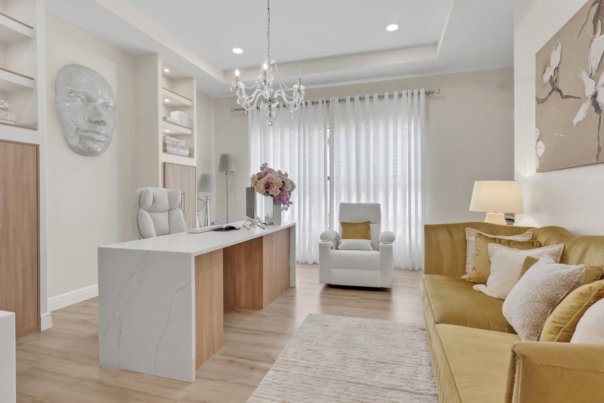 full home remodel home office with custom desk mustard sofa and chandelier in naples fl
