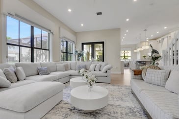 A open-concept living room with lots of natural light in a whole home remodel.