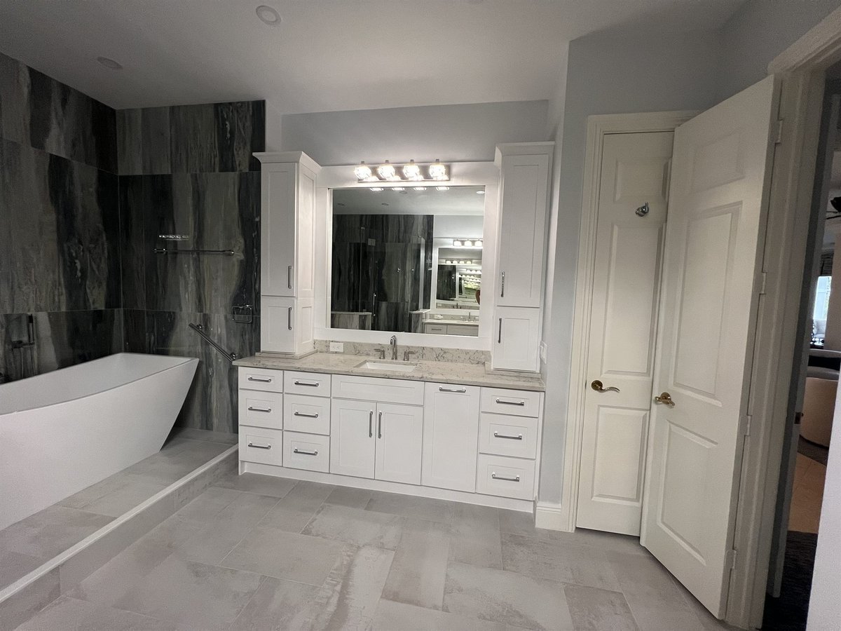 freestanding tub with white double vanity bathroom remodel - optimized
