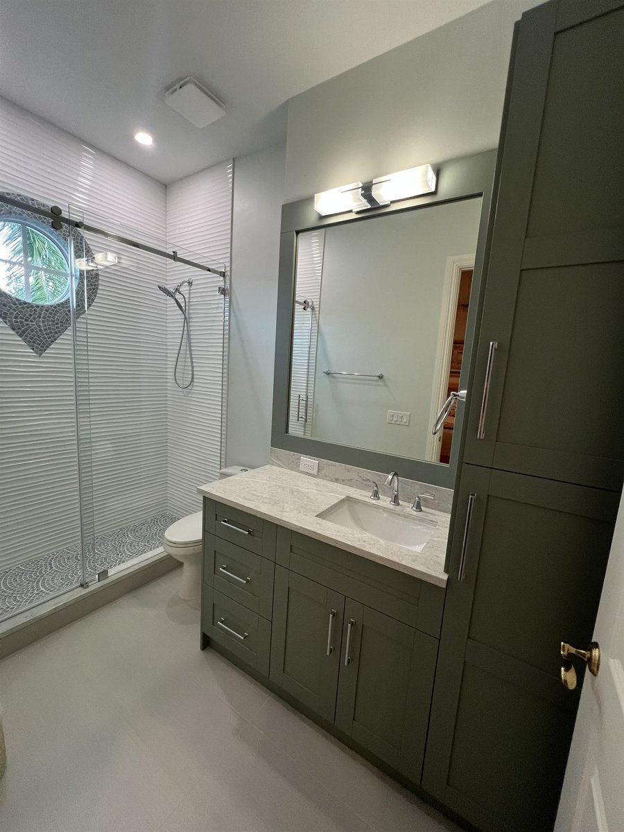green vanity with glass shower and teardrop window bathroom remodel - optimized