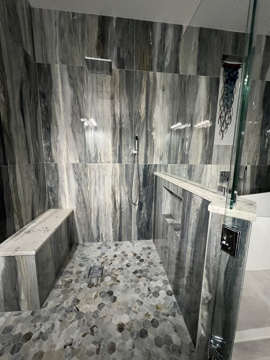 walk-in shower interior with pebble floor and bench bathroom remodel - optimized