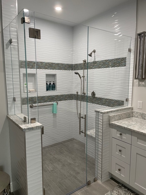 kitchen and bathroom remodel walk in glass shower with mosaic tile accents in naples fl