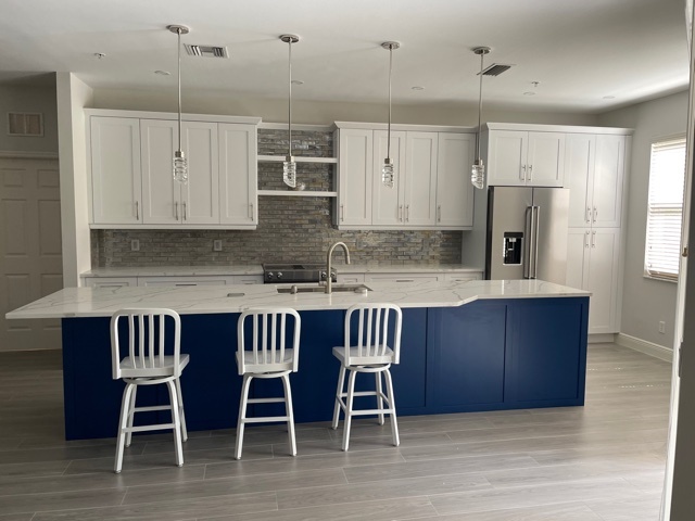 kitchen and bathroom remodel with blue island white cabinets and quartz counters in naples fl