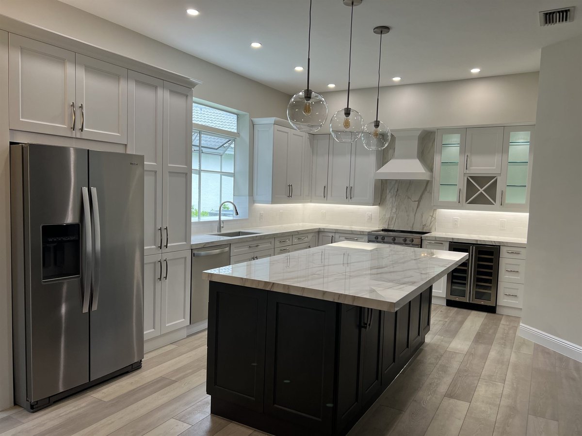 stainless french door fridge white cabinets dark island marble countertop kitchen remodel - optimized