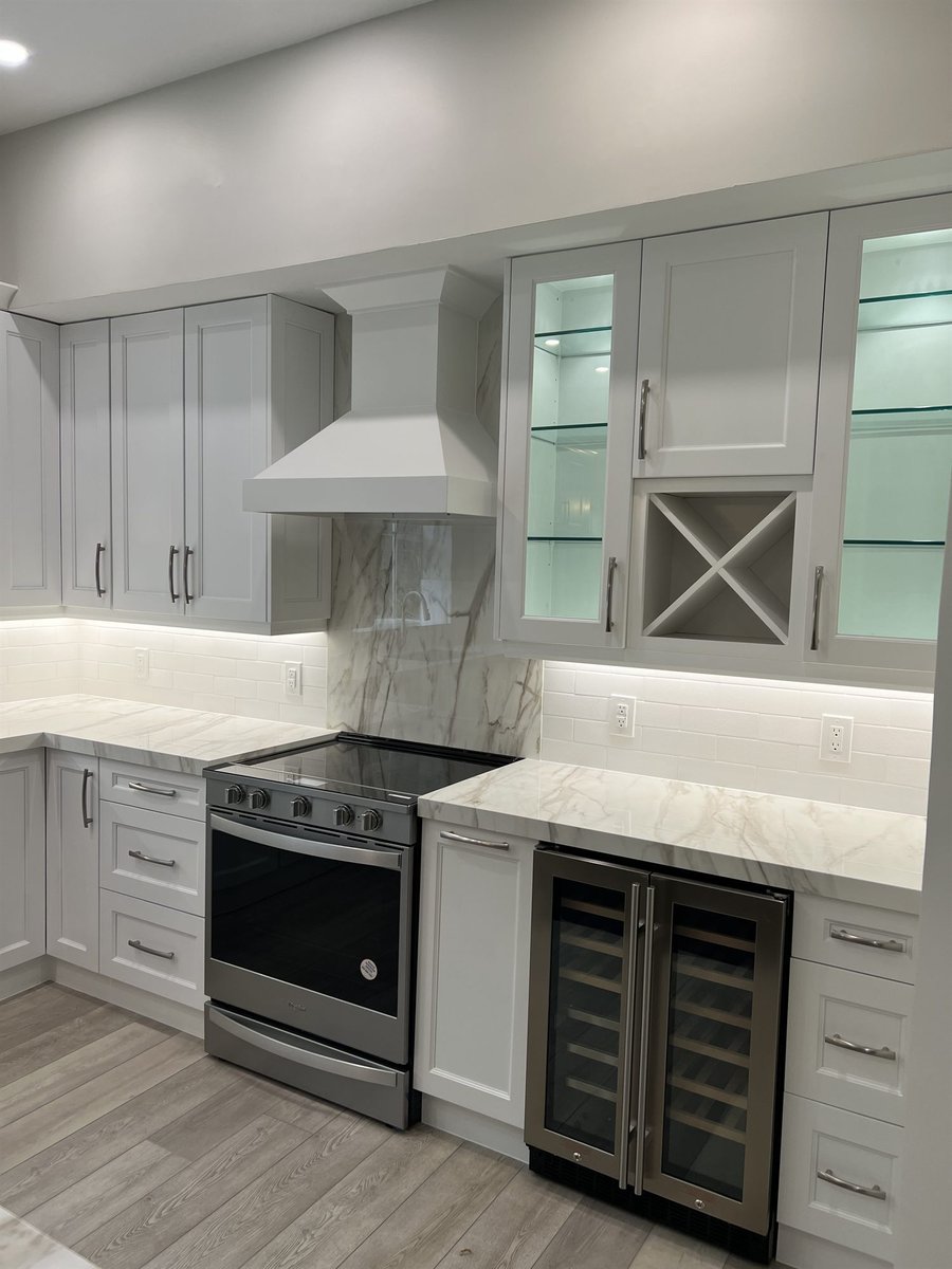 stainless range with glass-front cabinets and beverage fridge kitchen remodel - optimized