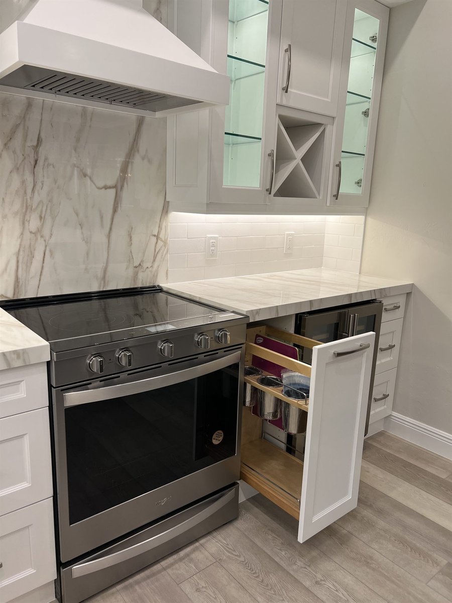 stainless range with pull-out spice rack and marble backsplash kitchen remodel - optimized