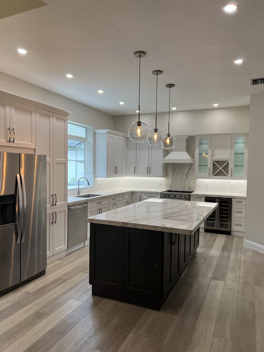 white shaker cabinets charcoal island marble countertops stainless appliances kitchen remodel - optimized