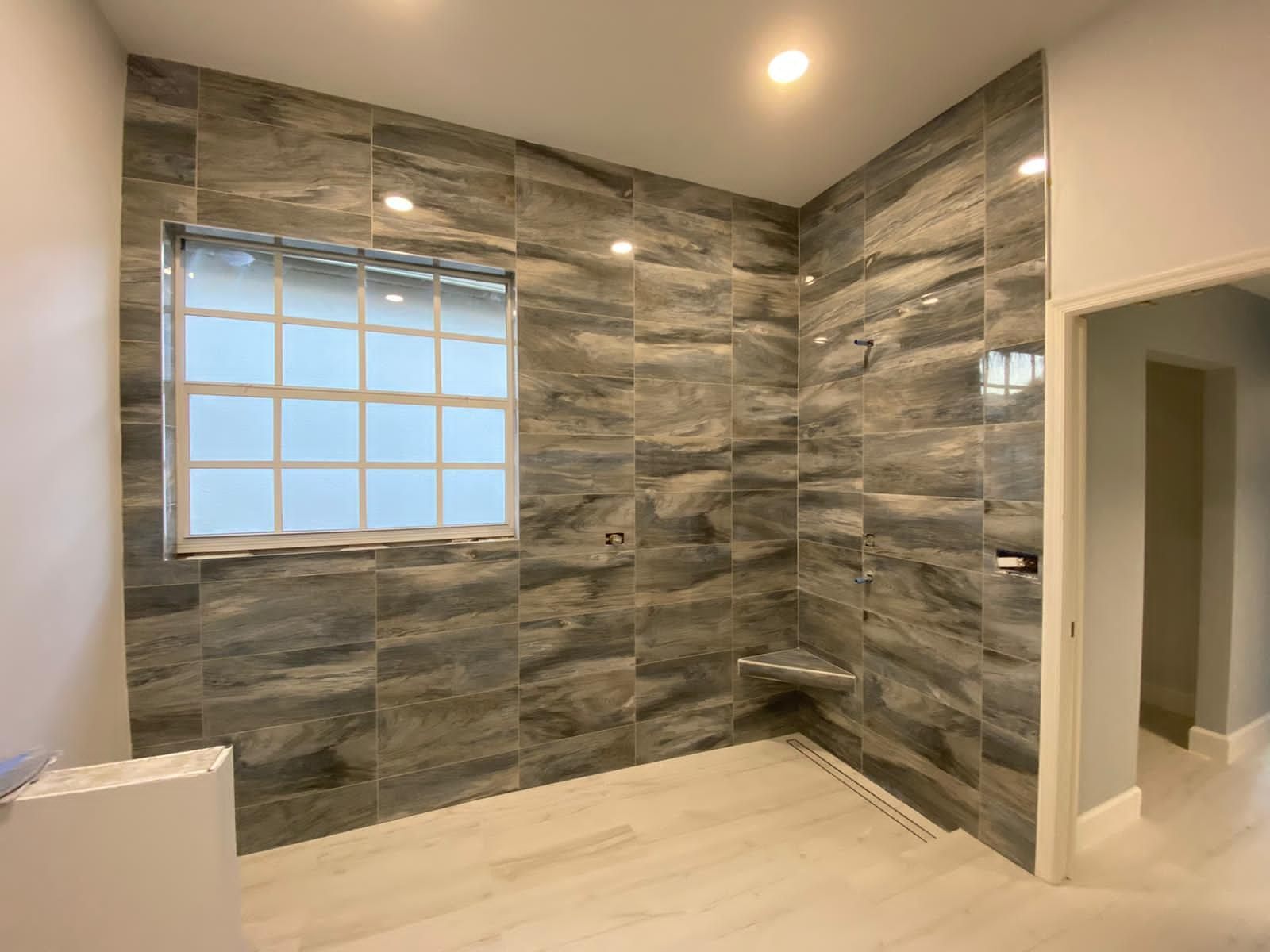 walk-in shower with gray marble tile glass block window and bench bathroom renovation - optimized