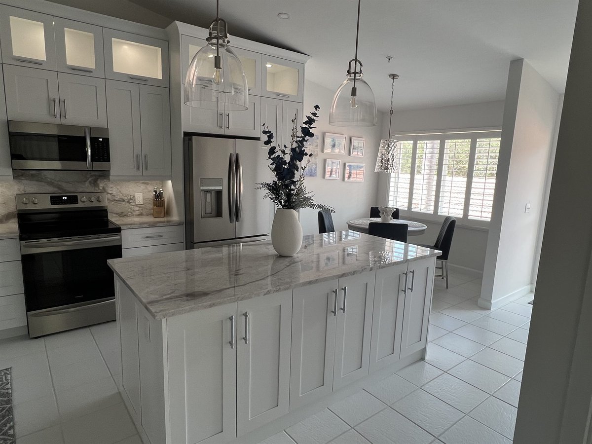 white kitchen with built-in wall oven and center island kitchen remodel - optimized