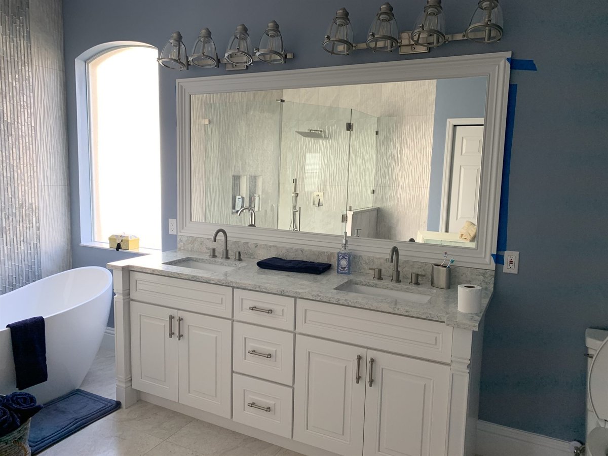 double sink marble vanity with framed mirror and soaking tub bathroom remodel - optimized