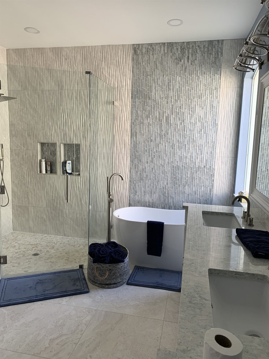 freestanding tub beside glass shower with textured tile bathroom remodel - optimized