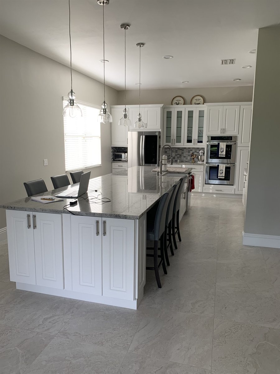white shaker kitchen island with barstools and pendant lighting kitchen remodel - optimized