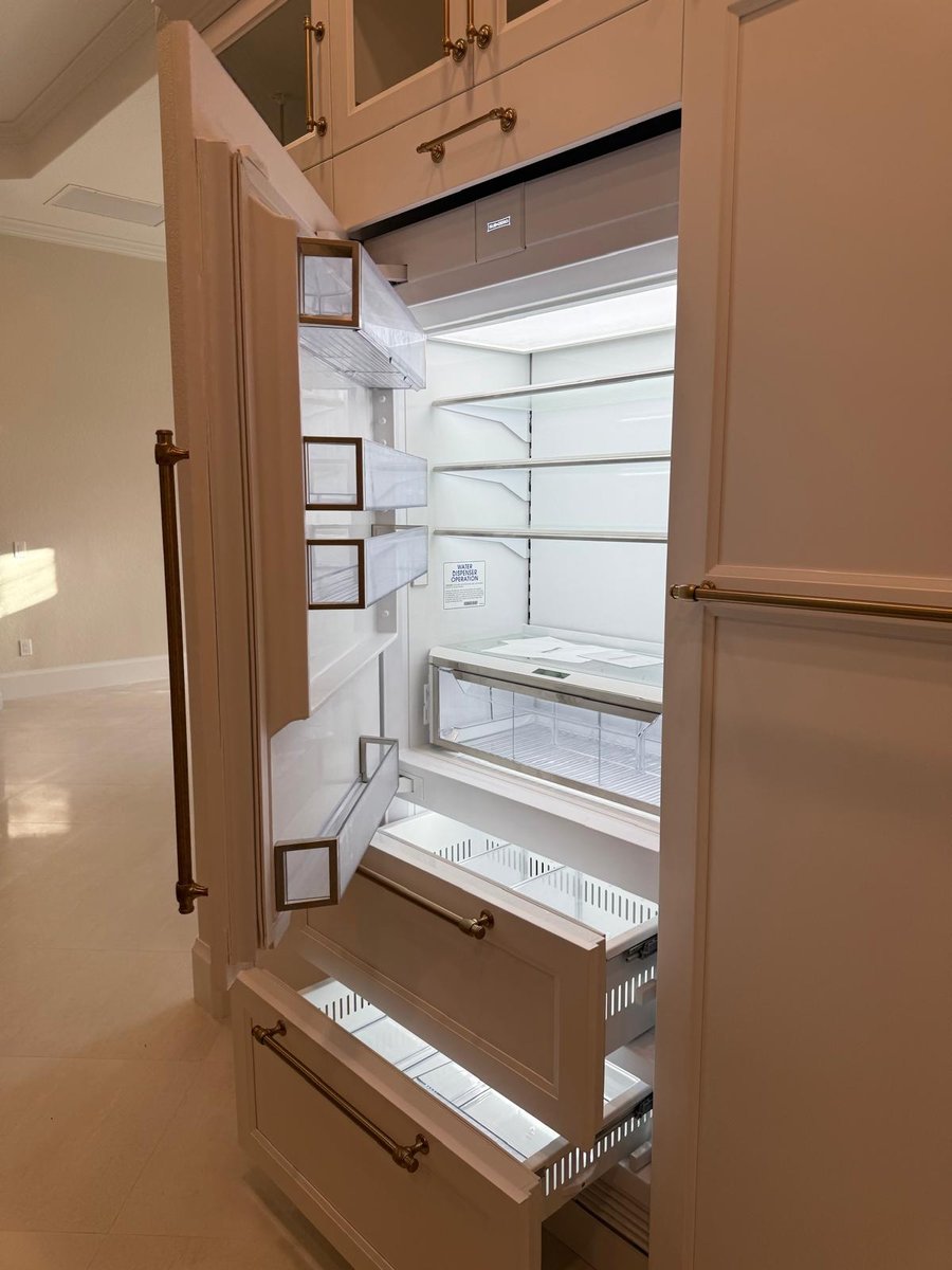 full home remodel built in refrigerator with custom cabinetry and pullout freezer drawers in naples fl