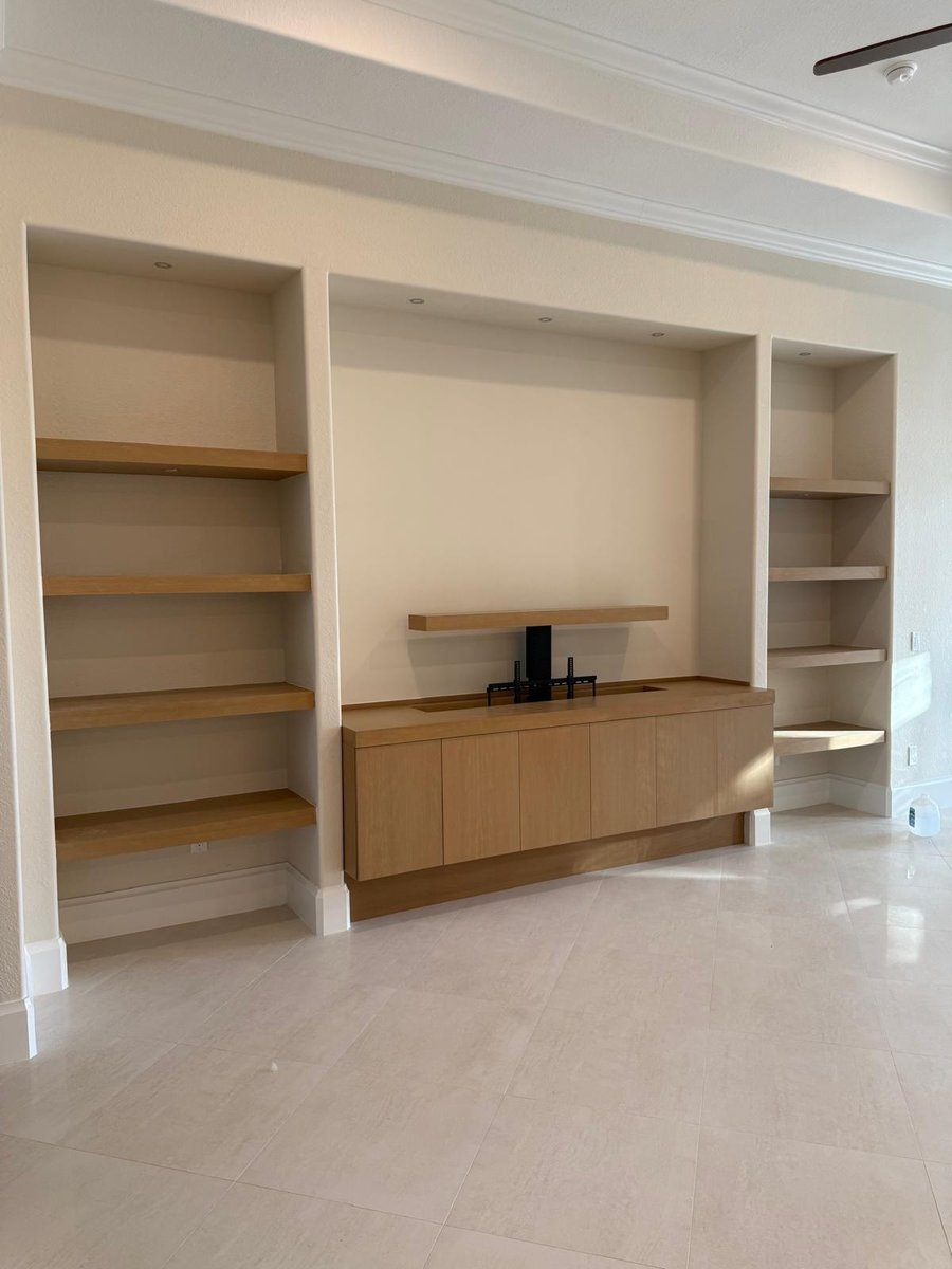 full home remodel custom living room built ins with floating wood shelves in naples fl