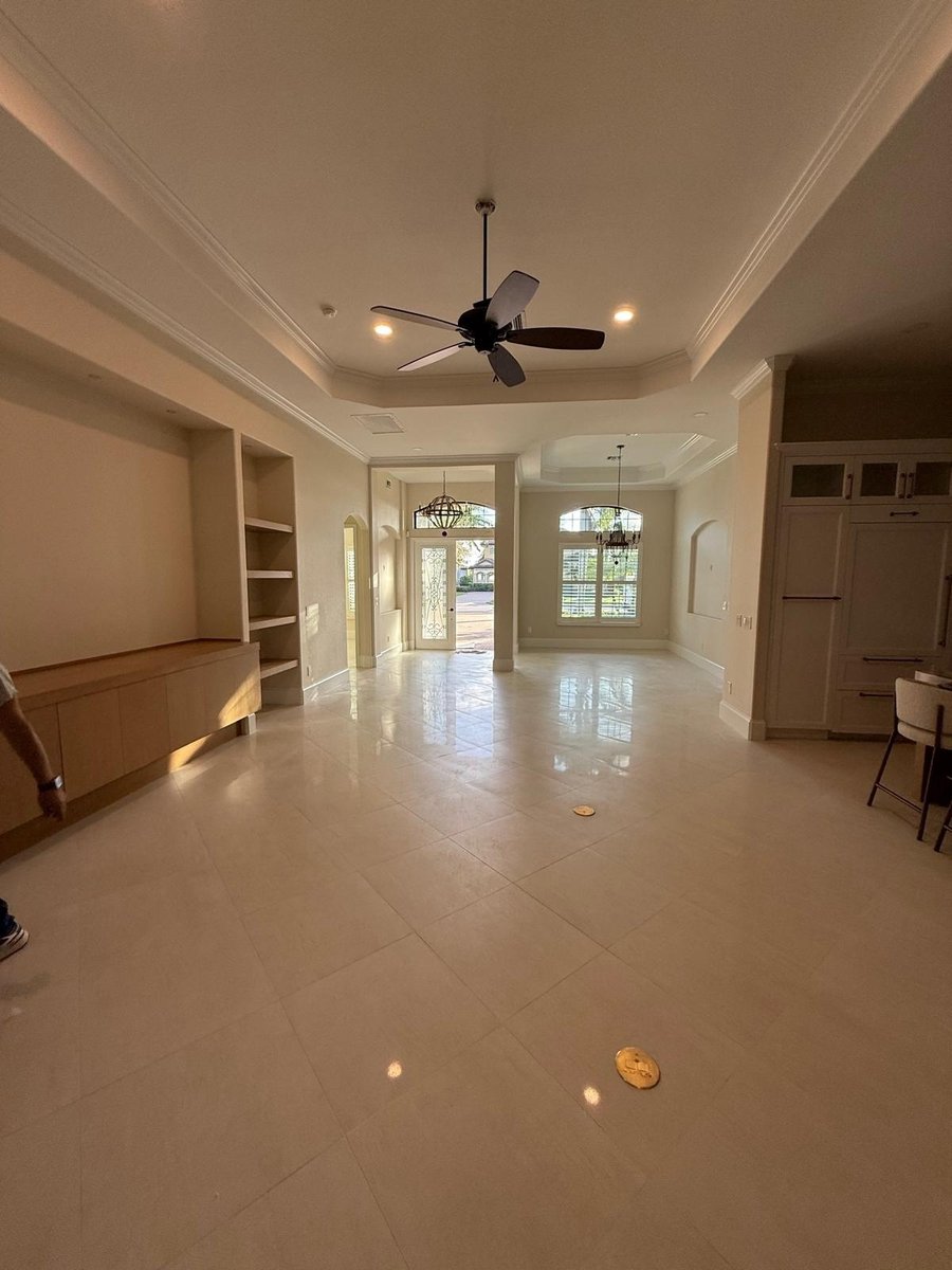full home remodel open living and dining area with custom built ins and tray ceilings in naples fl