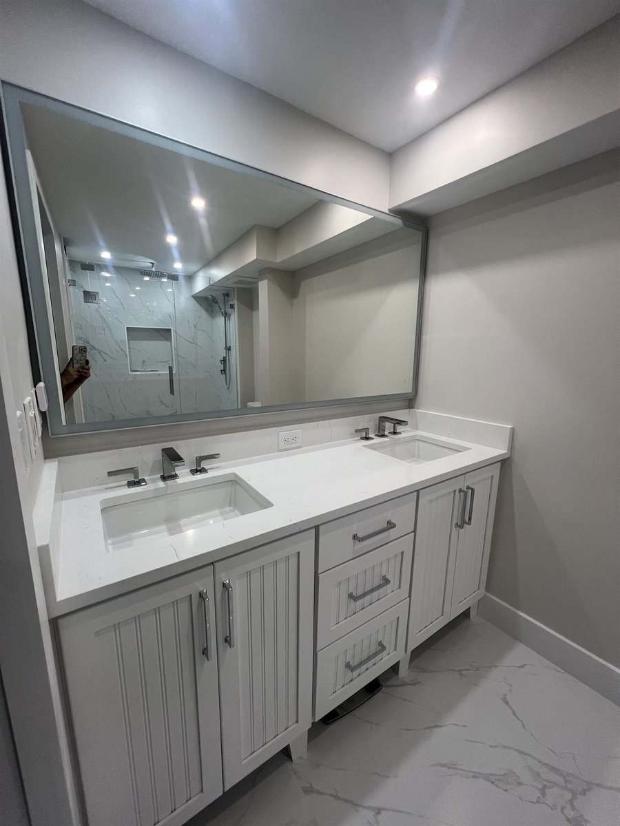 double sink vanity with marble floor primary bathroom renovation