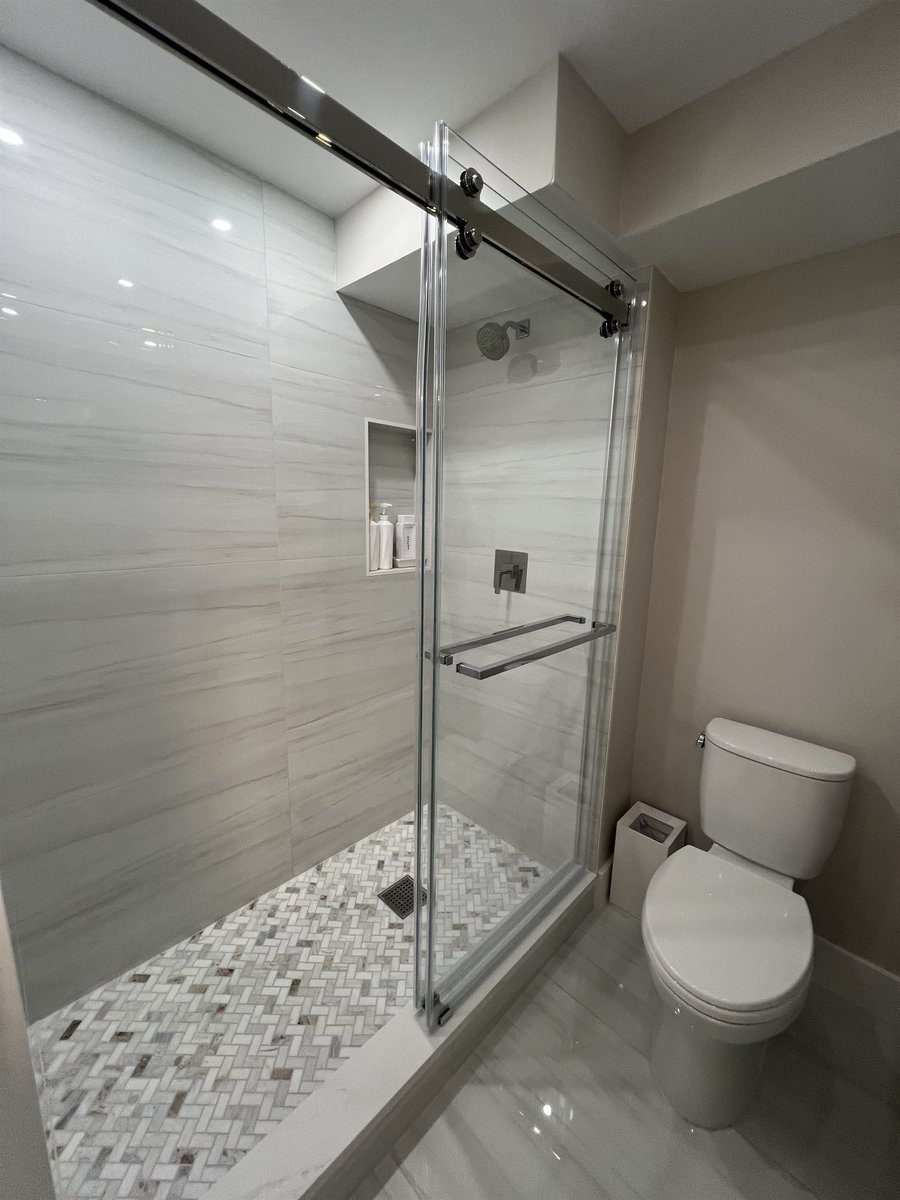 glass shower with mosaic tile floor and toilet bathroom renovation - optimized