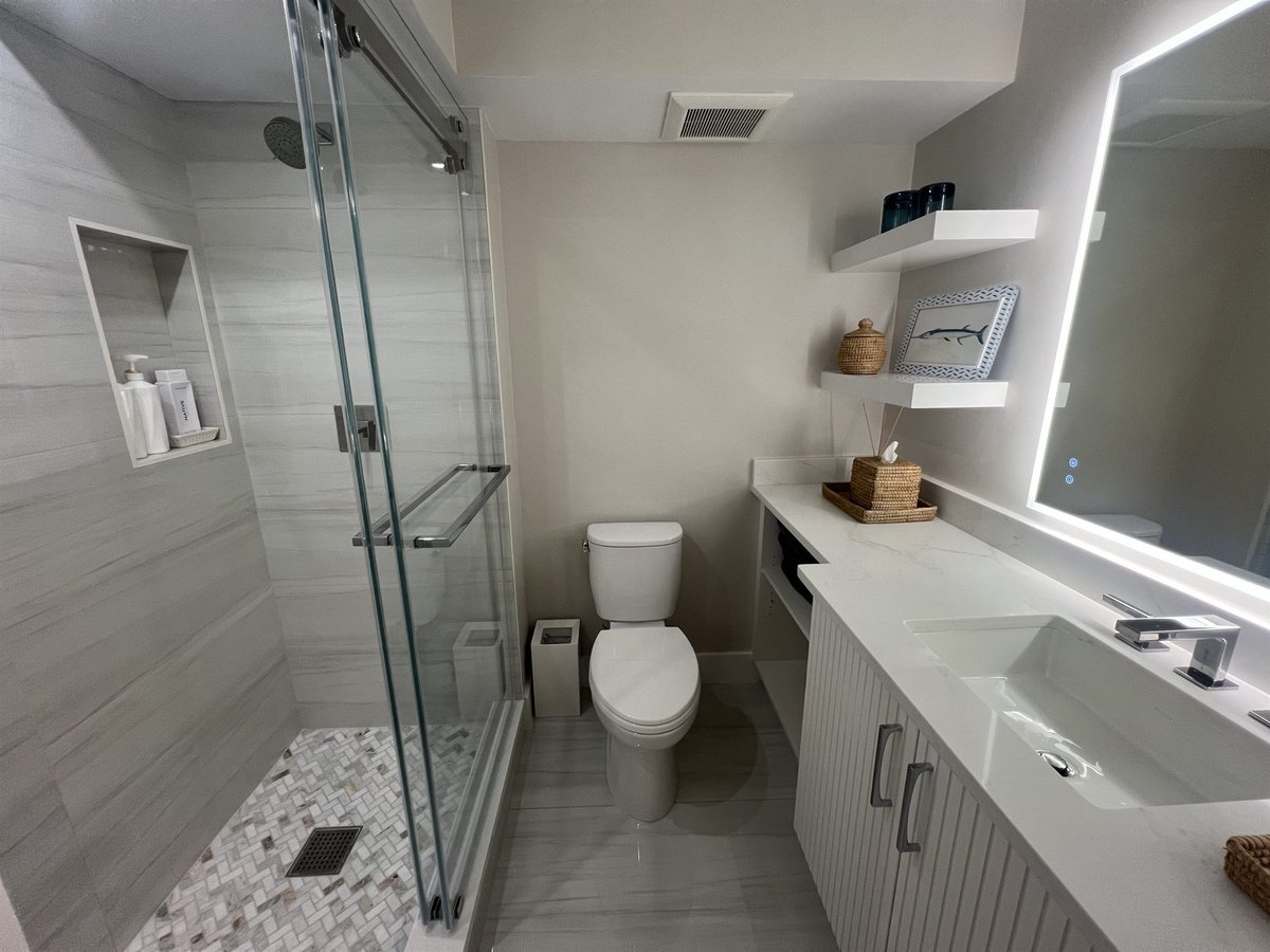 glass walk-in shower with toilet and floating vanity bathroom renovation - optimized