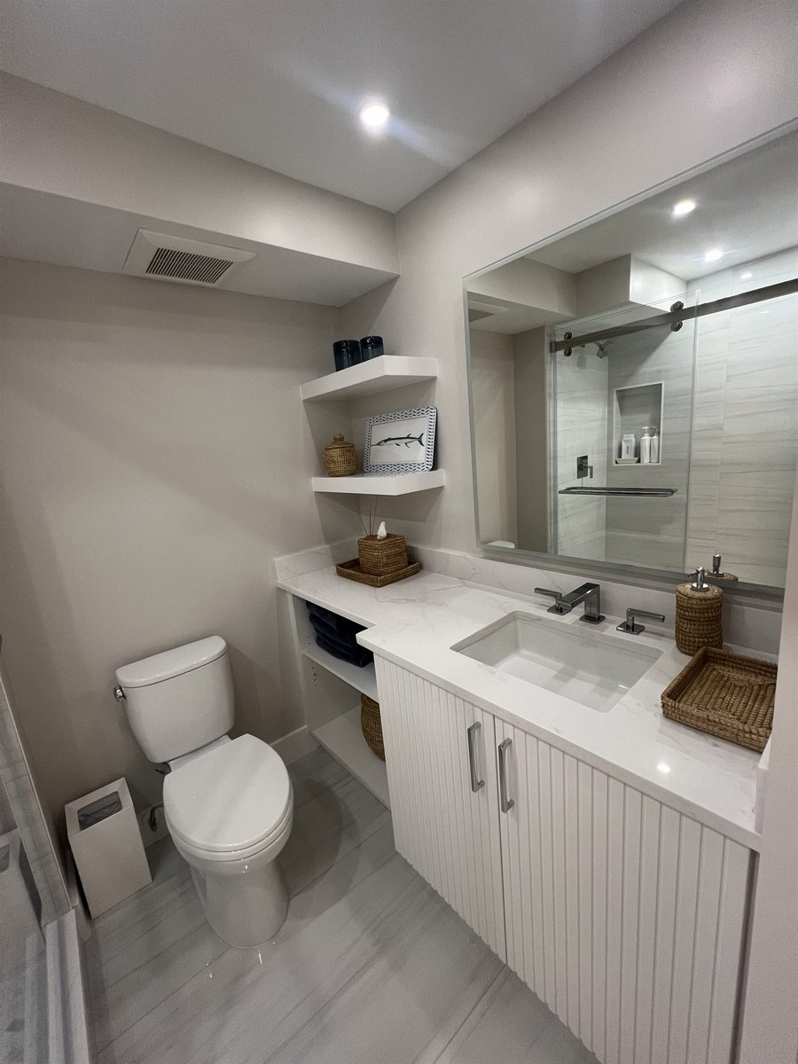 single vanity with toilet and corner shelving bathroom renovation - optimized