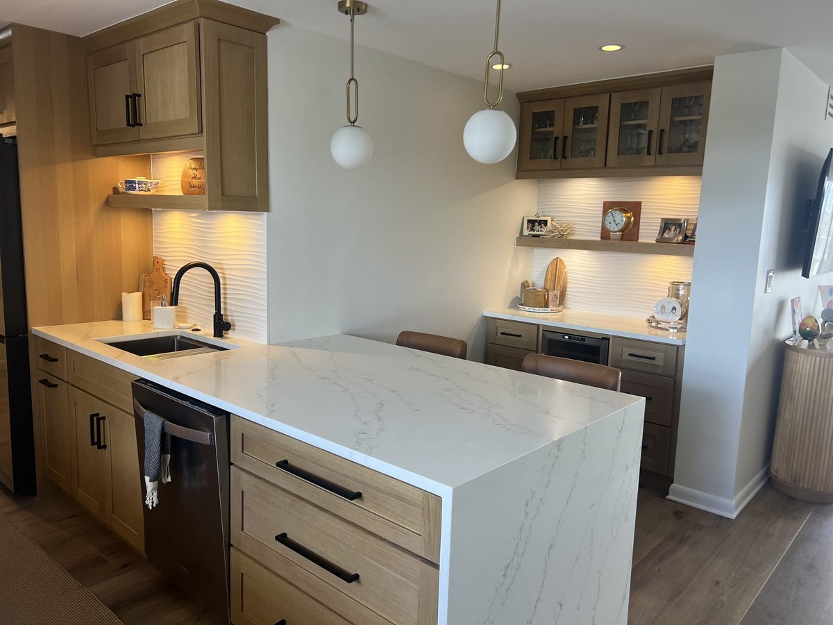 waterfall quartz island with brass globe pendants and open shelving kitchen remodel - optimized