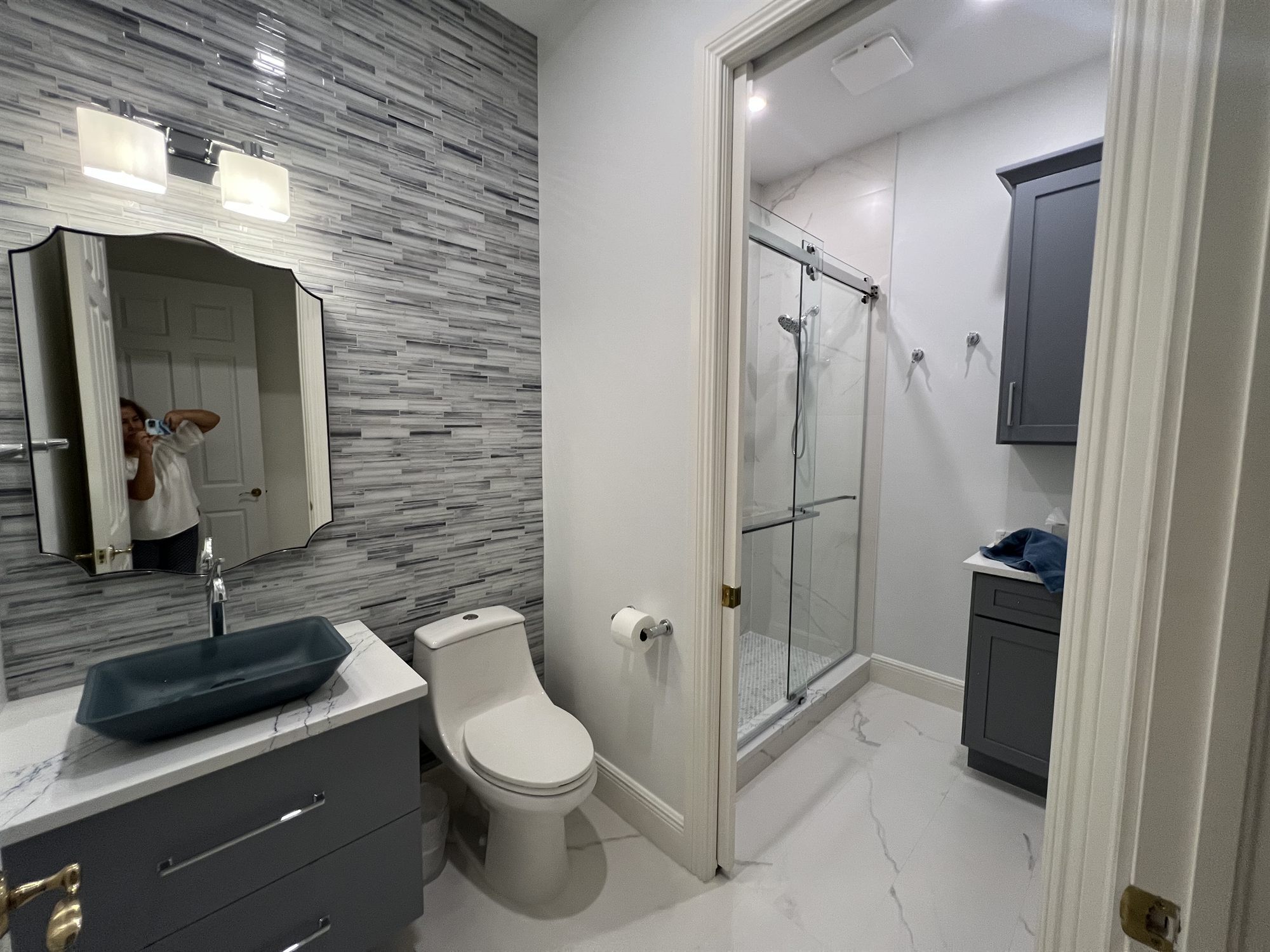 gray vanity with vessel sink and arched mirror bathroom remodel - optimized