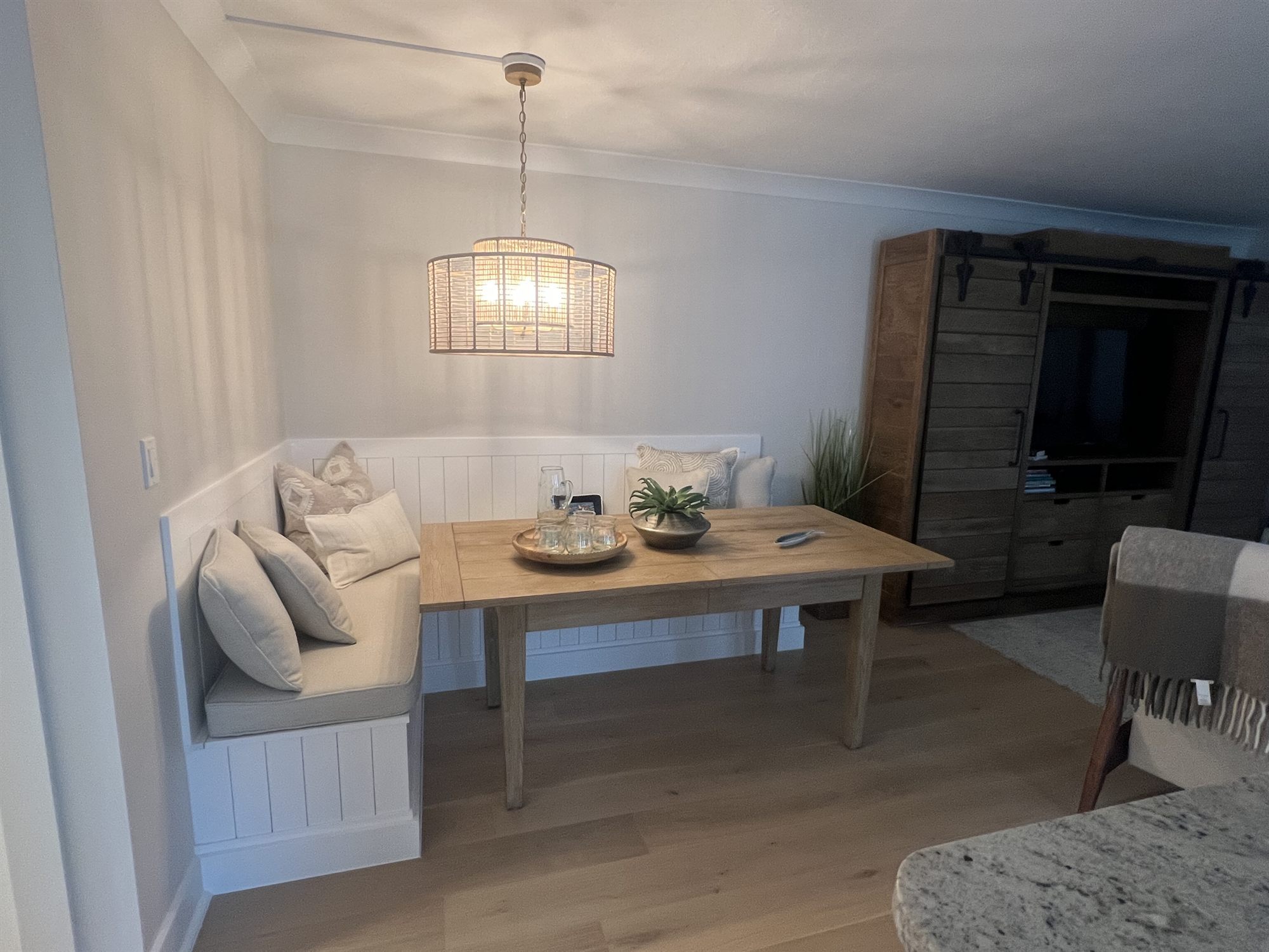 built-in banquette breakfast nook with wood table dining room renovation - optimized