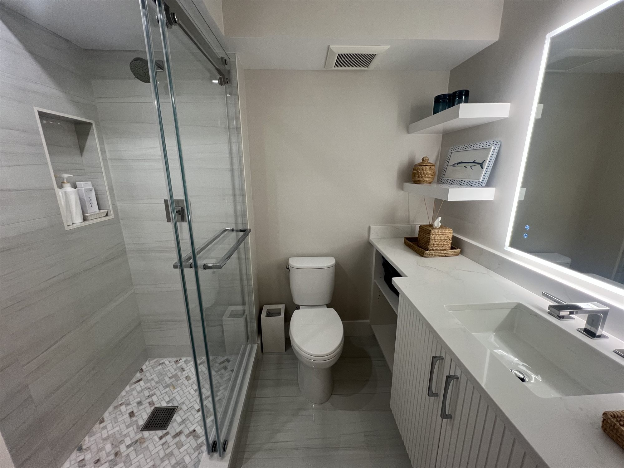 glass walk-in shower with toilet and floating vanity bathroom renovation - optimized